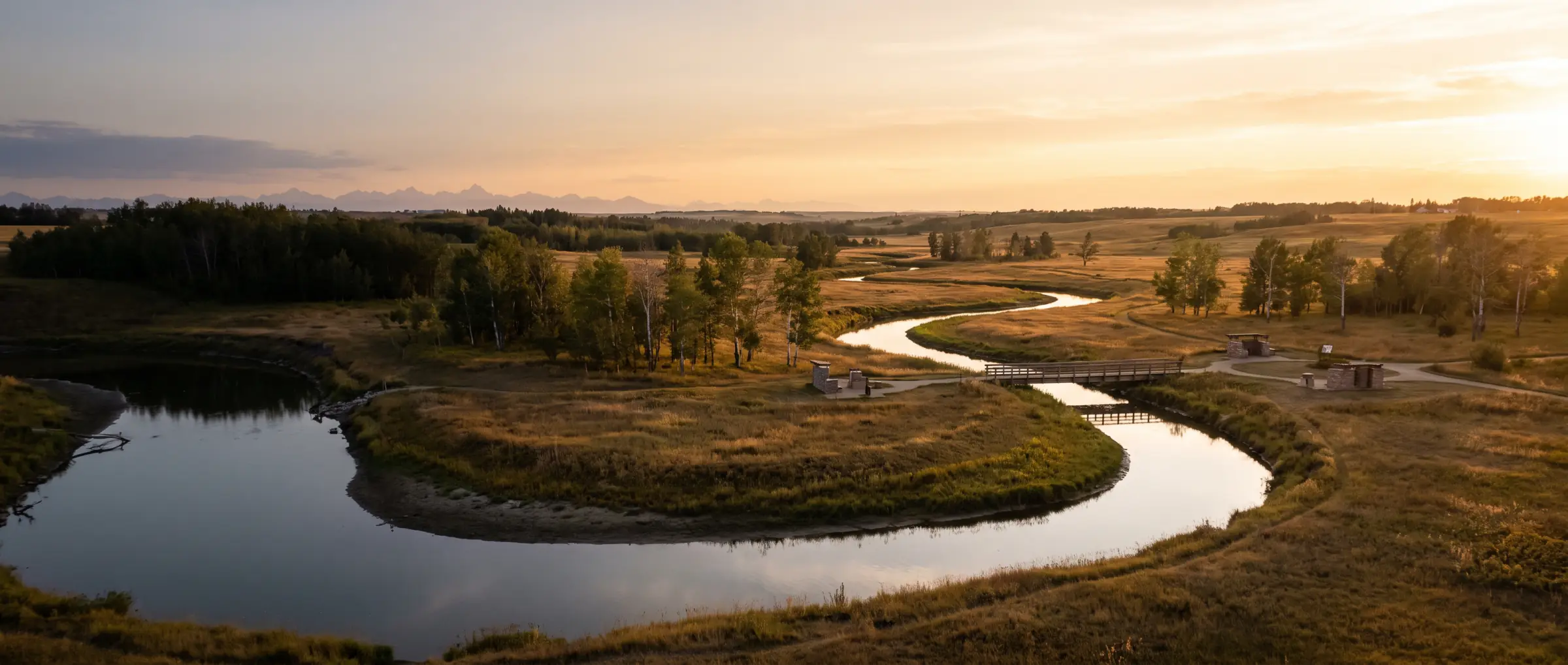Christian-Owned Businesses in Airdrie, AB: Nose Creek winding through prairie parkland